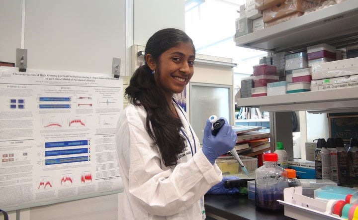 Deepika Kurup, a recipient of he Gloria Barron prize, working in a lab