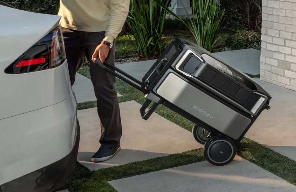 A photo of a person using the DELTA Pro Ultra with EcoFlow's portable trolley.