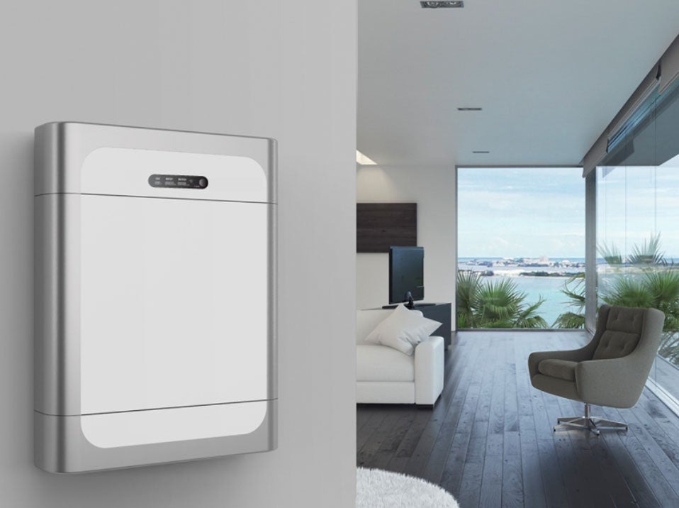A photo of a HomeGrid Compact series battery mounted on an interior wall of a home