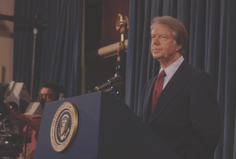 jimmy carter standing at podium as president